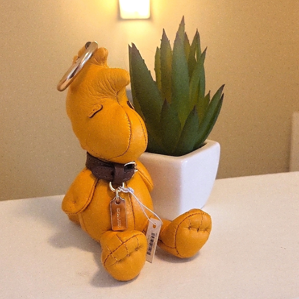 Coach x Peanuts Woodstock charm